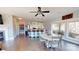Open living area showcasing the kitchen bar with seating, dining table, and expansive views from the large windows at 22970 Lake Tillery Rd, Albemarle, NC 28001