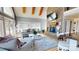 Cozy living room features a stone fireplace, comfortable seating, and a view to the outside at 22970 Lake Tillery Rd, Albemarle, NC 28001