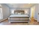 Relaxing primary bedroom showcasing a plush bed and bedside tables with lamps at 22970 Lake Tillery Rd, Albemarle, NC 28001