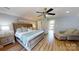 Inviting primary bedroom with a king bed, ceiling fan, and access to a balcony at 22970 Lake Tillery Rd, Albemarle, NC 28001