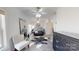 Spacious bedroom features tile floors, large mirror, furniture and ceiling fan at 22970 Lake Tillery Rd, Albemarle, NC 28001