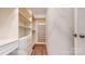 Well-organized walk-in closet with custom shelving and drawers for optimal storage at 22970 Lake Tillery Rd, Albemarle, NC 28001
