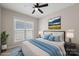 Comfortable bedroom with a ceiling fan and modern interior at 2620 Merion Hills Ct, Charlotte, NC 28269