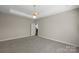 Spacious bedroom features natural light, neutral paint, and carpeted floors at 2620 Merion Hills Ct, Charlotte, NC 28269