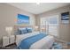 Cozy bedroom with a queen-sized bed, large window, and elegant decor at 2620 Merion Hills Ct, Charlotte, NC 28269