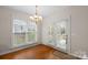 Bright breakfast nook with door to the patio and view of the backyard at 2620 Merion Hills Ct, Charlotte, NC 28269