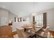 Bright dining room featuring hardwood floors, wainscotting, and a large dining table at 2620 Merion Hills Ct, Charlotte, NC 28269