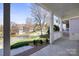 Charming covered front porch with white railing and lush landscaping at 2620 Merion Hills Ct, Charlotte, NC 28269