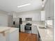 Well-equipped kitchen with stainless steel appliances and sleek countertops, ample lighting at 2620 Merion Hills Ct, Charlotte, NC 28269