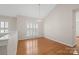 Bright living area features hardwood floors, natural light, and neutral paint at 2620 Merion Hills Ct, Charlotte, NC 28269