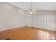 Bright, open living room with hardwood floors and vaulted ceiling at 2620 Merion Hills Ct, Charlotte, NC 28269
