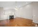 Spacious living room with hardwood floors and a cozy fireplace at 2620 Merion Hills Ct, Charlotte, NC 28269