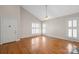 Bright, airy living room with hardwood floors, large windows and neutral walls at 2620 Merion Hills Ct, Charlotte, NC 28269