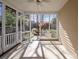 View of the screened porch, the screen door and the backyard at 2620 Merion Hills Ct, Charlotte, NC 28269