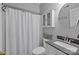 Cozy bathroom featuring a shower with curtain, gray countertop, and white cabinetry at 27 Heritage Ct, Lake Wylie, SC 29710