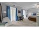 Bright bedroom with blue curtains, a small desk, and ample natural light at 27 Heritage Ct, Lake Wylie, SC 29710