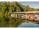Picturesque boat dock with multiple boat slips nestled by the lake at 27 Heritage Ct, Lake Wylie, SC 29710