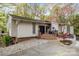 Beautiful home with a charming entrance, stone accents, and well-maintained landscaping for great curb appeal at 27 Heritage Ct, Lake Wylie, SC 29710