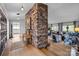 Inviting foyer showcasing a stone accent wall, hardwood floors, and seamless transition to living spaces at 27 Heritage Ct, Lake Wylie, SC 29710
