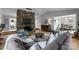 Cozy living room features a stone fireplace, hardwood floors, and an open layout for easy entertaining at 27 Heritage Ct, Lake Wylie, SC 29710