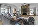 Inviting living area showcasing a stone fireplace, hardwood floors, and comfortable seating arrangement at 27 Heritage Ct, Lake Wylie, SC 29710