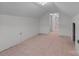 Unfinished attic room featuring angled ceiling and unfinished floors with doorway visible in the background at 28120 Ryan Rd, Richfield, NC 28137