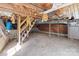 Unfinished basement with exposed beams and utilities, provides ample storage space at 28120 Ryan Rd, Richfield, NC 28137