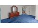 Cozy bedroom featuring a dresser, soft carpet, and access to other rooms at 28120 Ryan Rd, Richfield, NC 28137