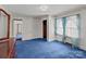 Spacious bedroom with soft carpet, natural light, and ample closet space at 28120 Ryan Rd, Richfield, NC 28137