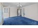 This bedroom boasts a spacious layout with soft, blue carpeting at 28120 Ryan Rd, Richfield, NC 28137