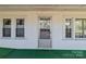Charming porch with white exterior and multiple windows at 28120 Ryan Rd, Richfield, NC 28137