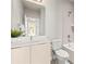 Bright bathroom features a large mirror and vanity with a tub/shower combination at 327 Uptown West Dr, Charlotte, NC 28208