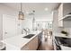 Modern kitchen boasts stainless steel appliances and a spacious island, ideal for cooking at 327 Uptown West Dr, Charlotte, NC 28208
