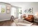 Inviting living room featuring hardwood floors, stylish furnishings, and ample natural light at 327 Uptown West Dr, Charlotte, NC 28208