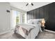 Serene bedroom with large windows, soft natural light, and stylish accent wall at 327 Uptown West Dr, Charlotte, NC 28208