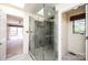 Bathroom featuring a glass enclosed shower with tiled walls, modern fixtures, and neutral color palette at 343 River Haven Dr, Taylorsville, NC 28681