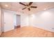 Spacious bedroom with hardwood floors, ceiling fan and closet providing a comfortable and serene living space at 343 River Haven Dr, Taylorsville, NC 28681