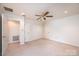Bright bedroom with a ceiling fan, neutral carpet, and closet providing a comfortable and serene living space at 343 River Haven Dr, Taylorsville, NC 28681