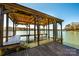 Spacious dock with covered seating, swing, and ladder for easy water access, perfect for relaxing at 343 River Haven Dr, Taylorsville, NC 28681