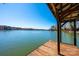 Lake view from covered dock features clear skies and calm water perfect for swimming, boating, or fishing at 343 River Haven Dr, Taylorsville, NC 28681