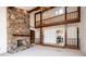 Spacious open floor plan featuring a stone fireplace and exposed beam accents at 343 River Haven Dr, Taylorsville, NC 28681
