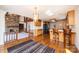 The living room flows to the kitchen with a stone fireplace, hardwood flooring, and natural light at 343 River Haven Dr, Taylorsville, NC 28681