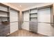 Spacious walk-in closet featuring custom shelving, drawers, and ample storage for an organized wardrobe at 343 River Haven Dr, Taylorsville, NC 28681