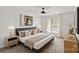 Well-lit bedroom with a ceiling fan, large windows, and stylish furnishings at 3939 Picasso Ct, Charlotte, NC 28205