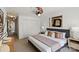 Spacious bedroom with a ceiling fan, plush carpet, large windows, and lots of storage at 3939 Picasso Ct, Charlotte, NC 28205