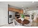 Cozy kitchen and breakfast nook featuring stainless steel appliances and tile floors at 3939 Picasso Ct, Charlotte, NC 28205