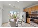 Bright kitchen area with stainless steel appliances, an eat-in nook, and tile flooring at 3939 Picasso Ct, Charlotte, NC 28205