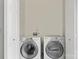 Enclosed laundry area with washer and dryer at 3939 Picasso Ct, Charlotte, NC 28205