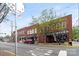 Street view of storefronts in a brick building with on-street parking at 3939 Picasso Ct, Charlotte, NC 28205