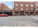 Exterior street view of a brick building with storefronts at 3939 Picasso Ct, Charlotte, NC 28205